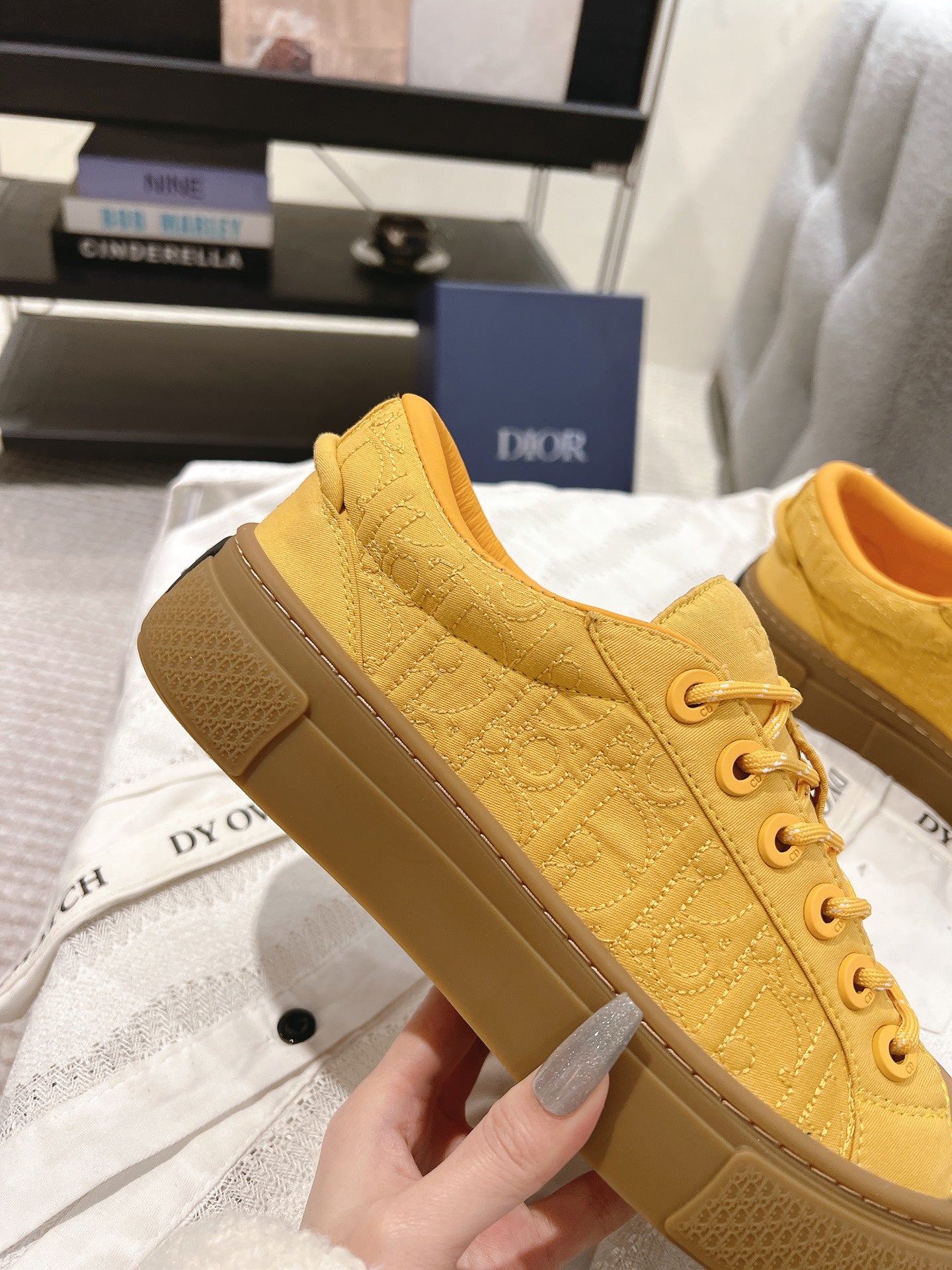 Yellow low-top sneaker with textured upper and thick rubber sole