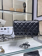 Black quilted leather flap bag with CC logo center and chain shoulder strap