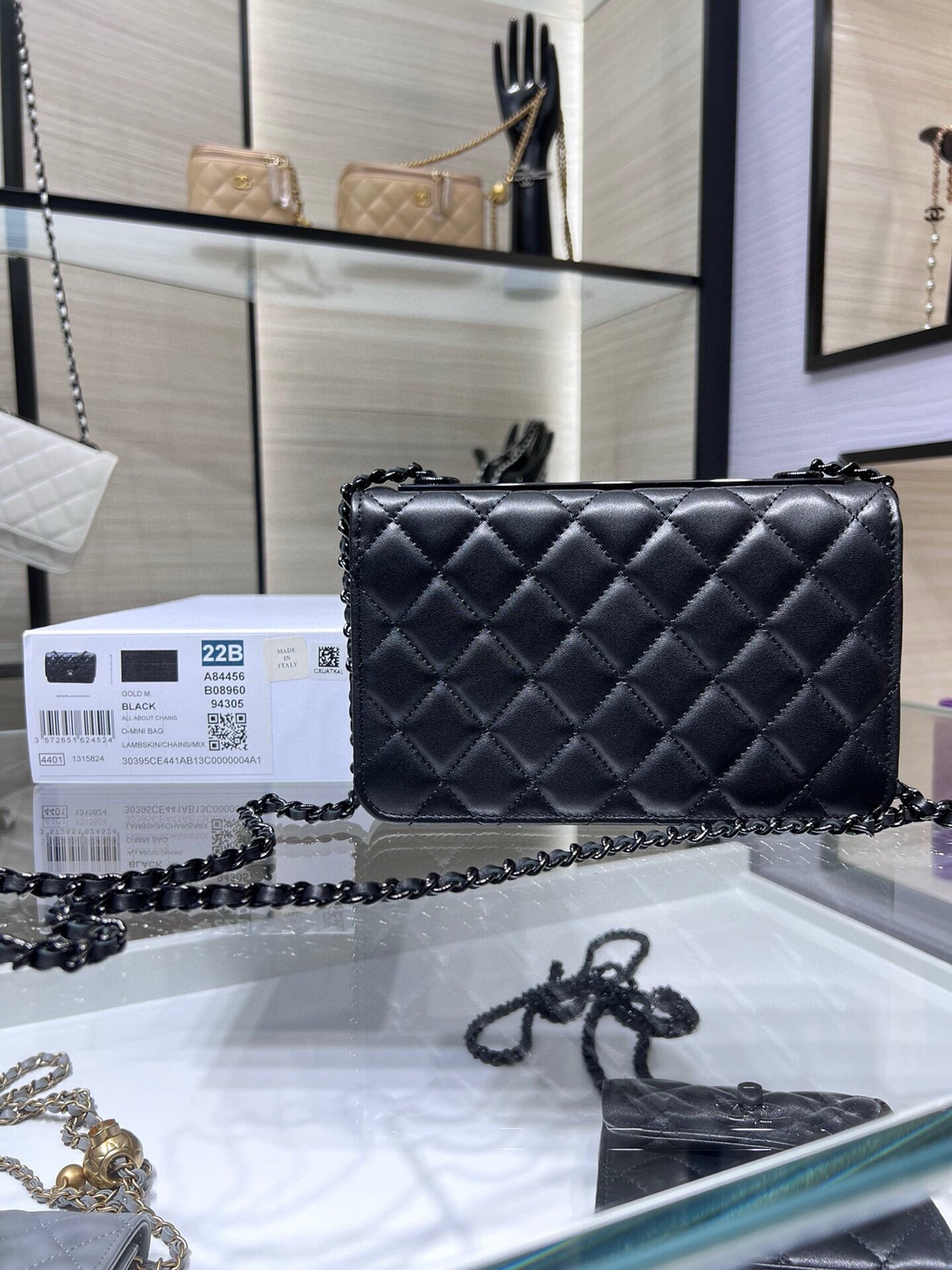 Black quilted leather flap crossbody bag with chain strap and front CC logo
