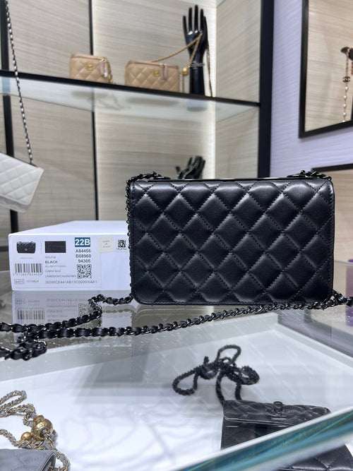Black quilted leather flap crossbody bag with chain strap and front CC logo
