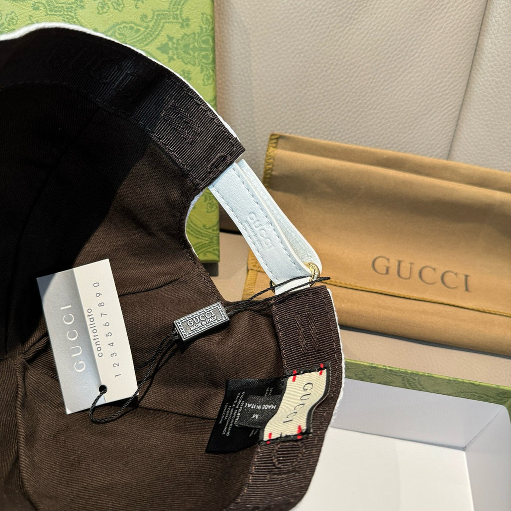 Dark Gucci baseball cap strap and interior detail with printed label