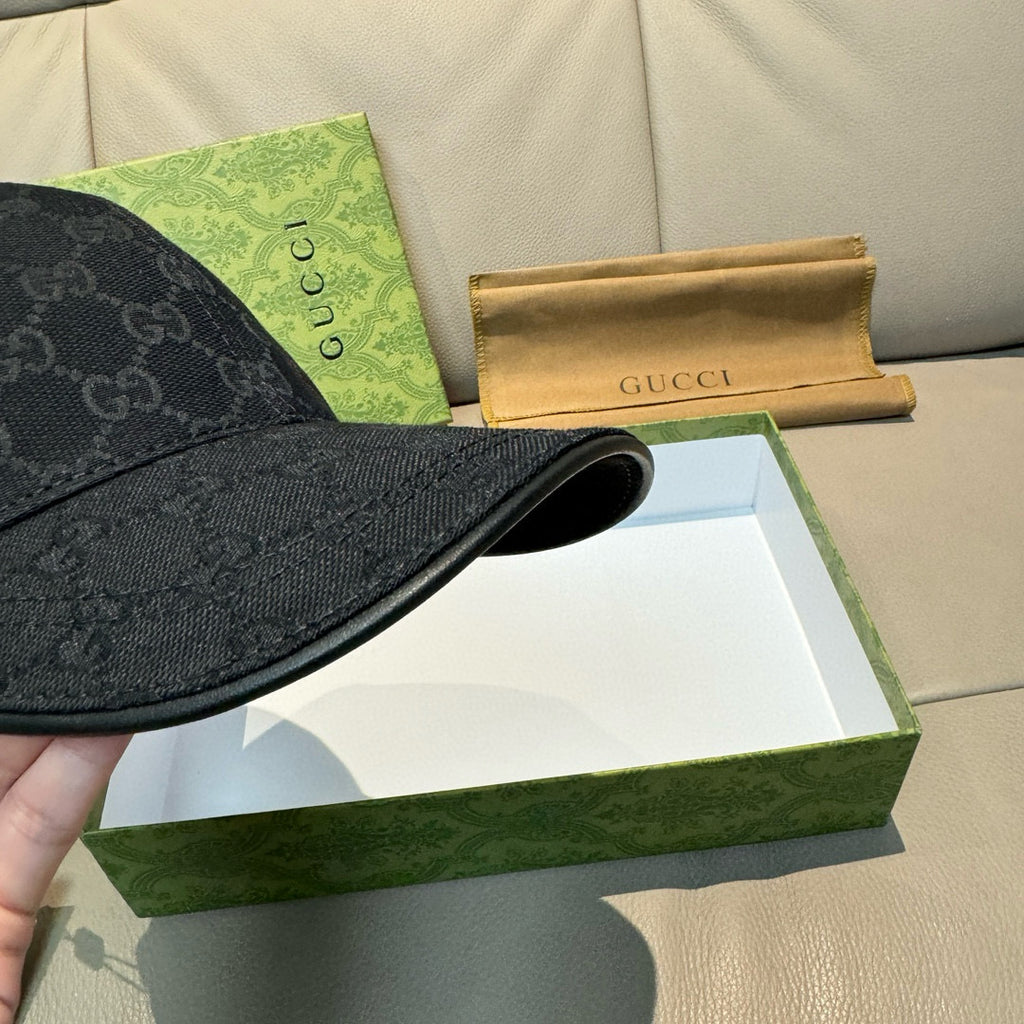 Gucci cap brim and edge stitching in dark GG monogram fabric.