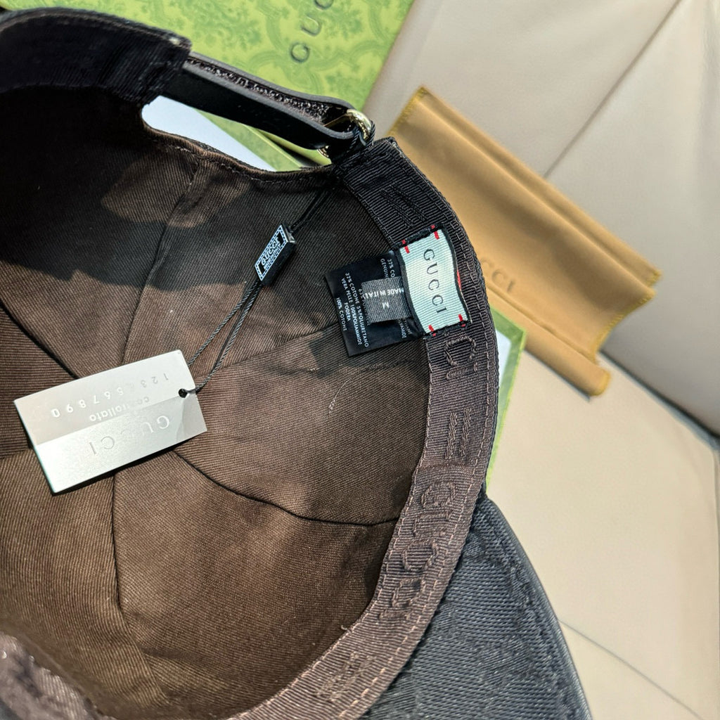 Gucci cap interior with stitched band and hang tags.