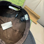 Gucci cap interior with stitched band and hang tags.
