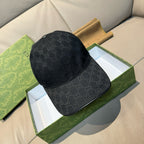 Gucci cap in dark GG monogram canvas with curved brim.