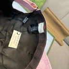 Gucci cap close-up with black fabric lining and adjustable web strap