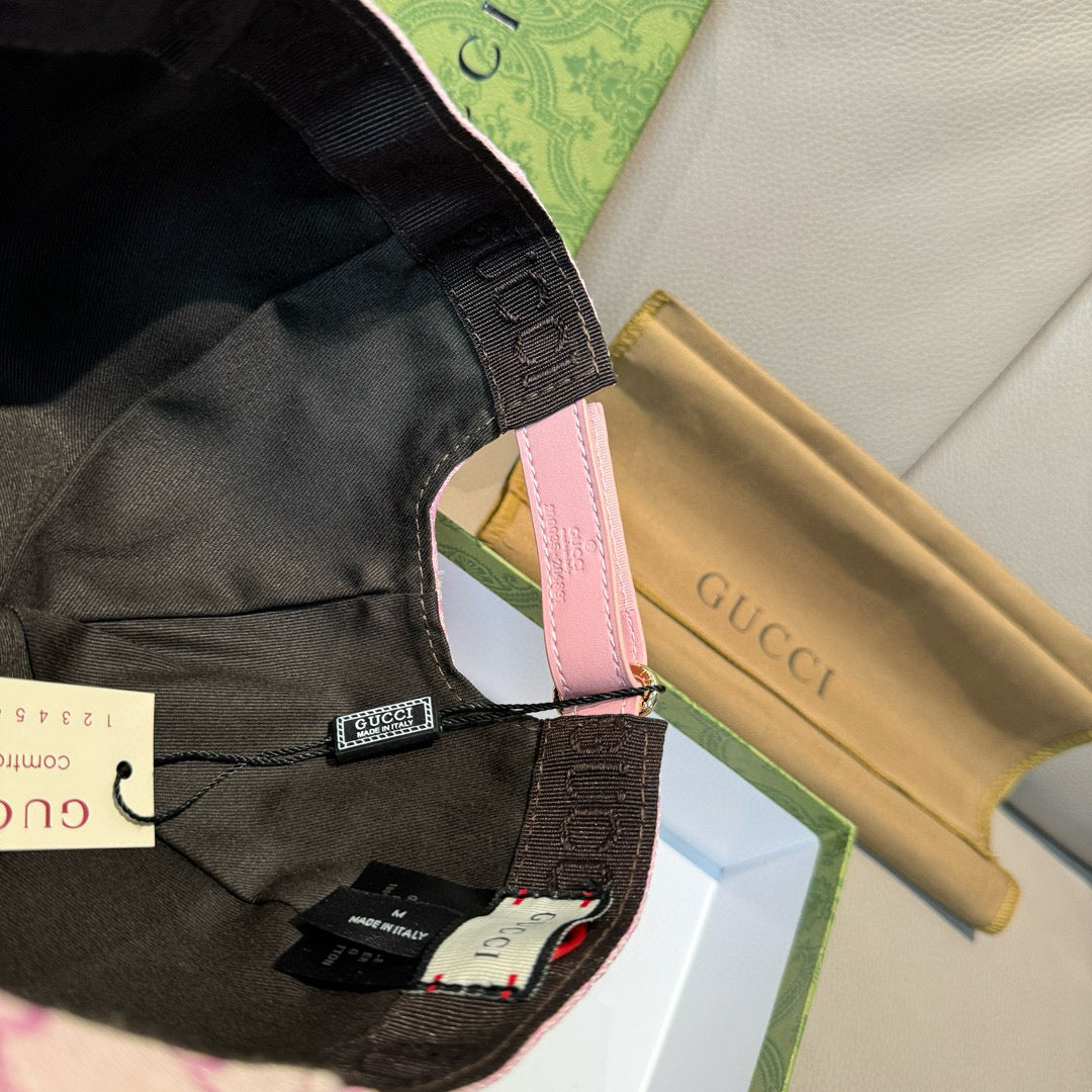 Gucci cap strap close-up on black cap with printed branding tab