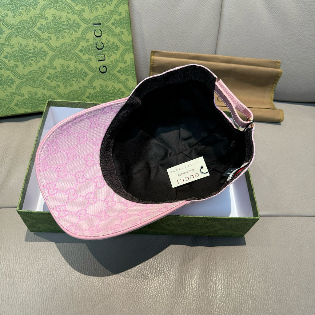 Gucci cap with light pink GG exterior and black interior lining