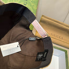 Gucci cap interior edge with black lining and pink trim, showing brand tags.