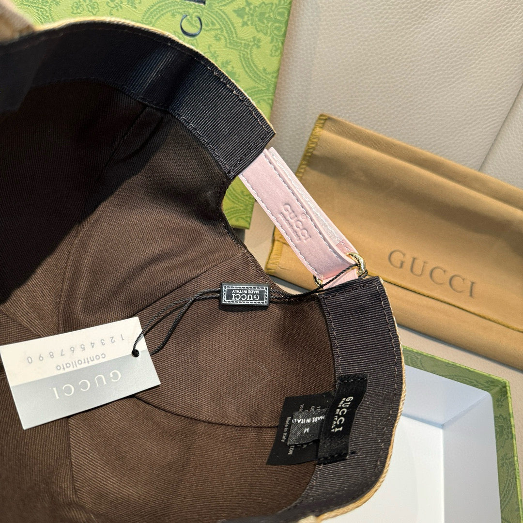 Gucci cap interior edge with black lining and pink trim, showing brand tags.