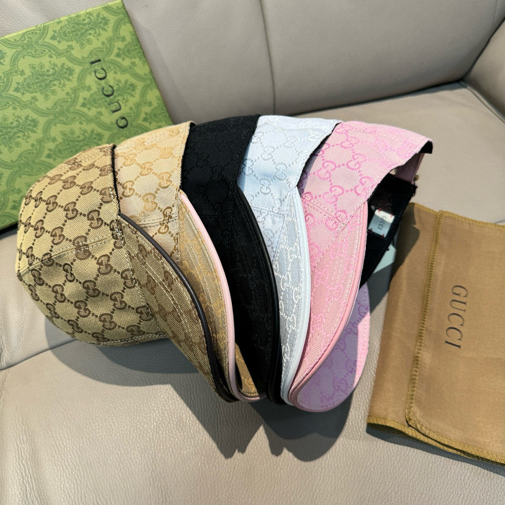 Gucci caps assortment: beige, black, white, and pink GG monogram styles with brims.