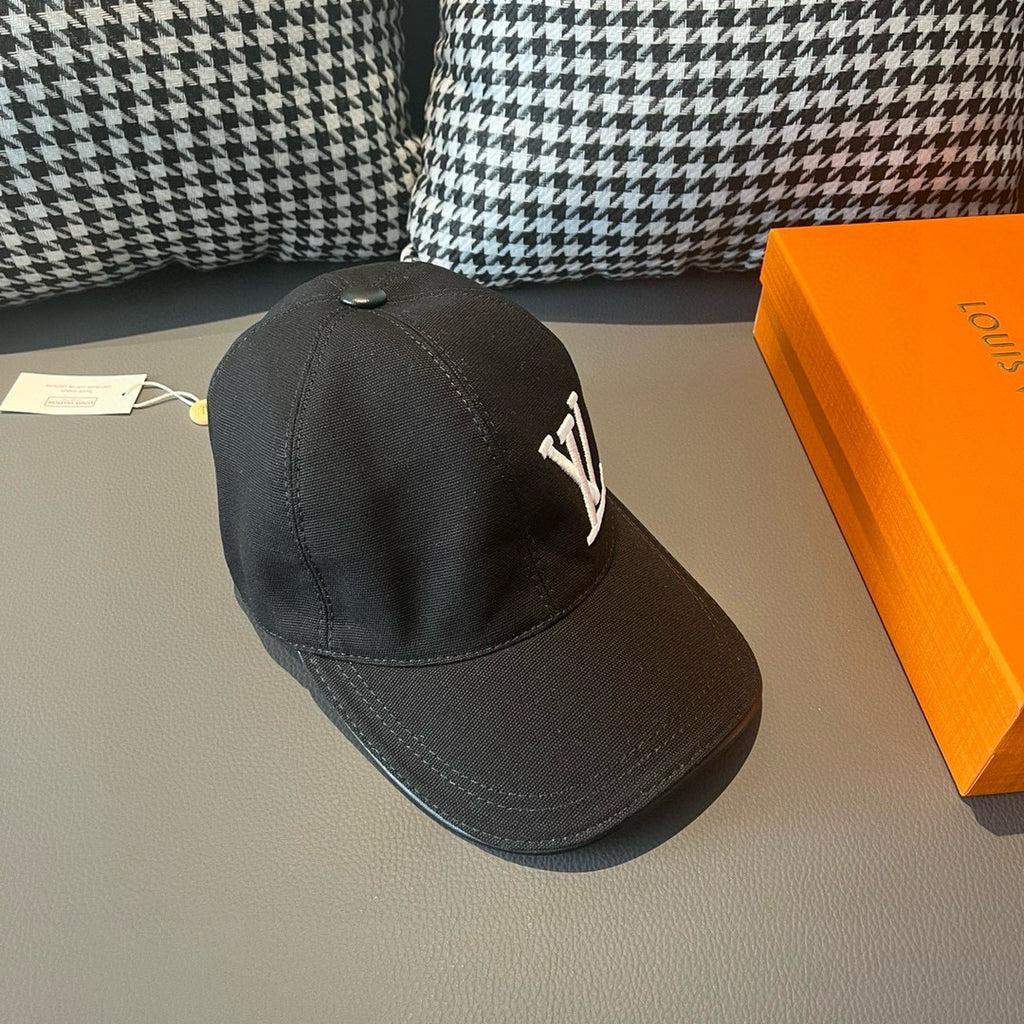 Black Louis Vuitton baseball cap with LV monogram on side panel