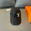 Black Louis Vuitton baseball cap with LV monogram on front panel