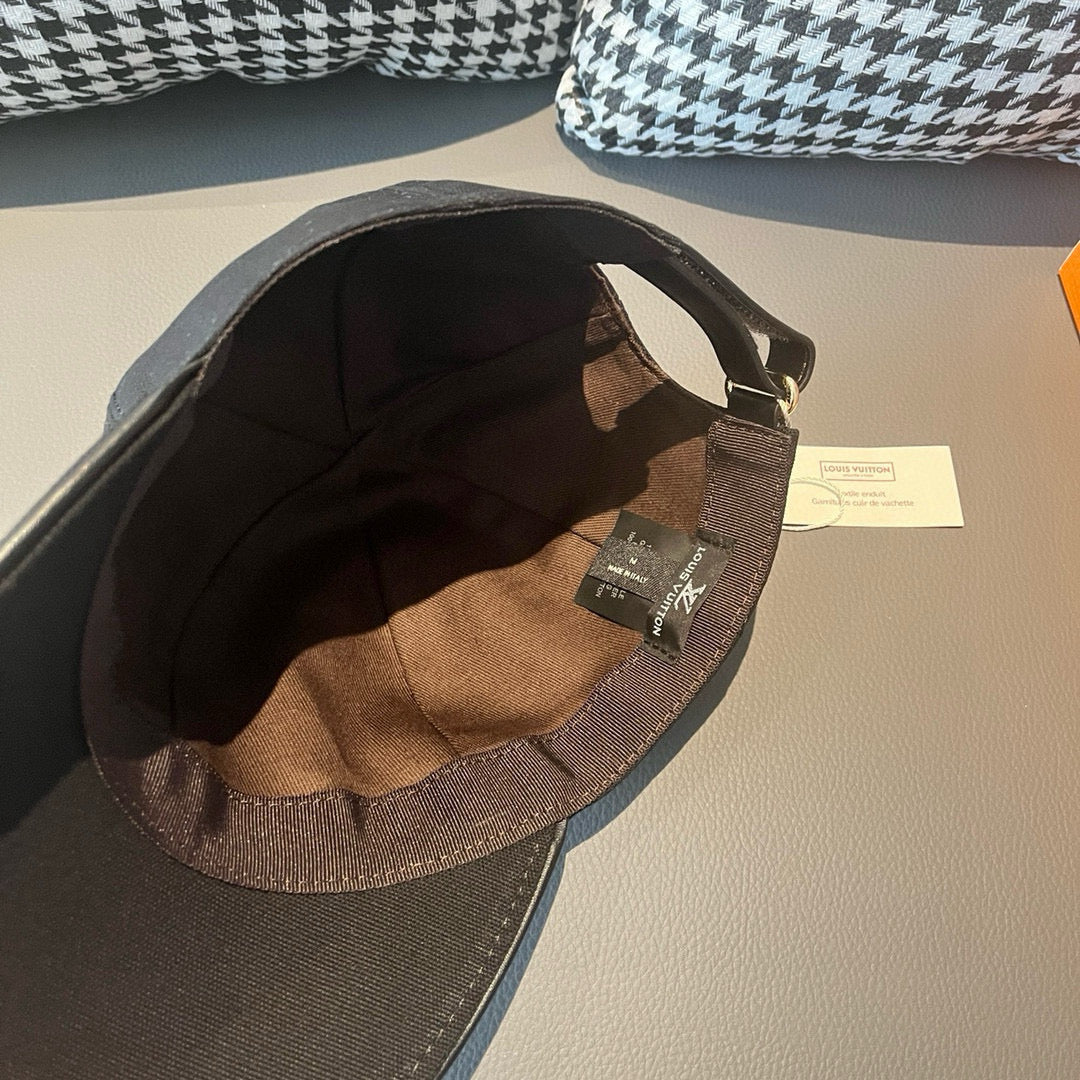 Black cap interior with Louis Vuitton branded tag and adjustable strap