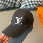 Black Louis Vuitton cap with LV monogram patch and curved brim