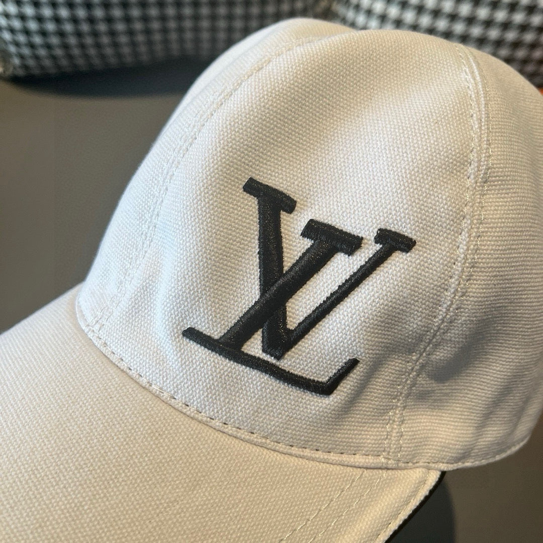 Louis Vuitton cap, white close-up with black LV monogram on crown