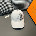 Light blue Louis Vuitton cap with black dog graphic and "Forever" logo on front