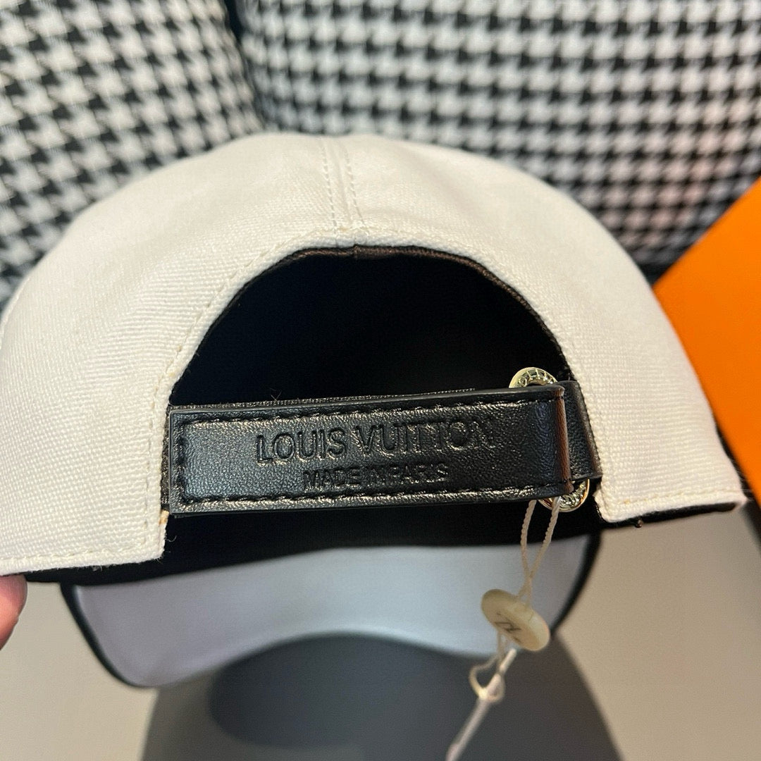 White Louis Vuitton cap interior with black adjuster strap and "LOUIS VUITTON" tag