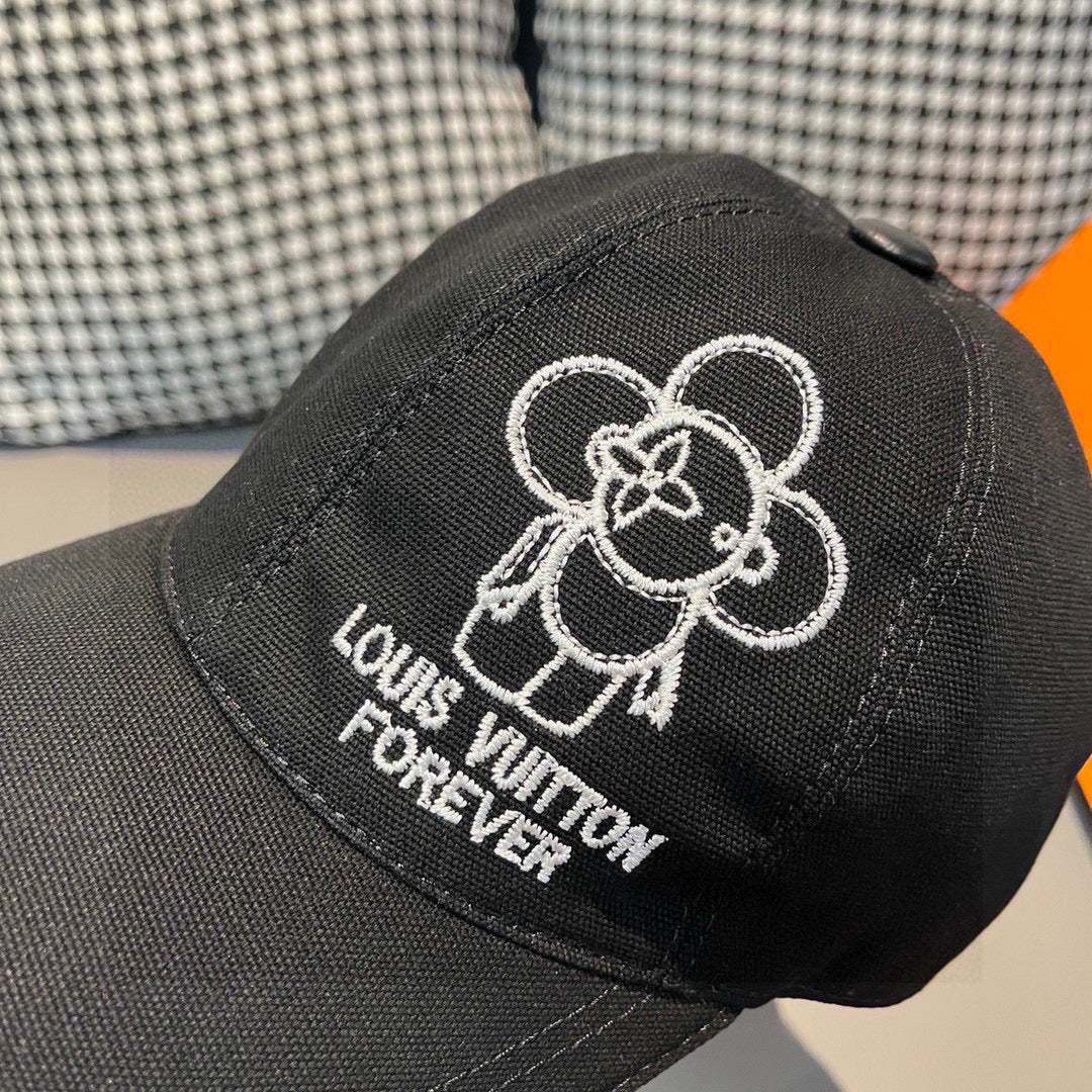 Black Louis Vuitton cap close-up with white embroidered flower logo and Forever text