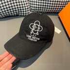 Black Louis Vuitton baseball cap, white embroidered flower logo and Forever text