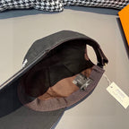 Black Louis Vuitton cap interior view with fabric lining and adjustable strap