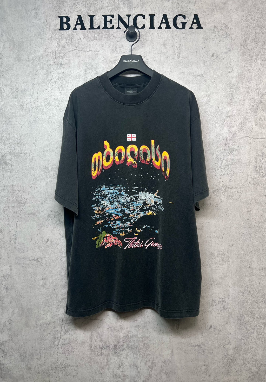 Graphic crew-neck T-shirt in dark gray with colorful lettering and abstract print