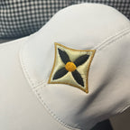 Louis Vuitton cap front close-up with embroidered four-point star patch