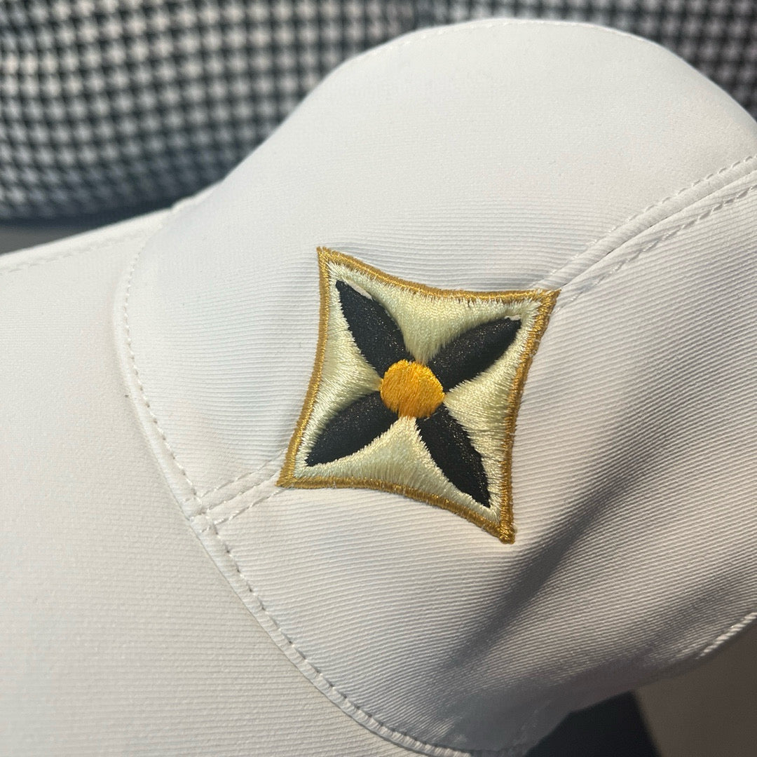 Louis Vuitton cap front close-up with embroidered four-point star patch