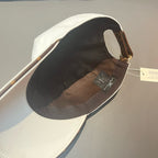 Louis Vuitton white baseball cap interior with dark lining and adjustable strap