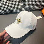 Louis Vuitton white baseball cap with embroidered star emblem, angled close side view