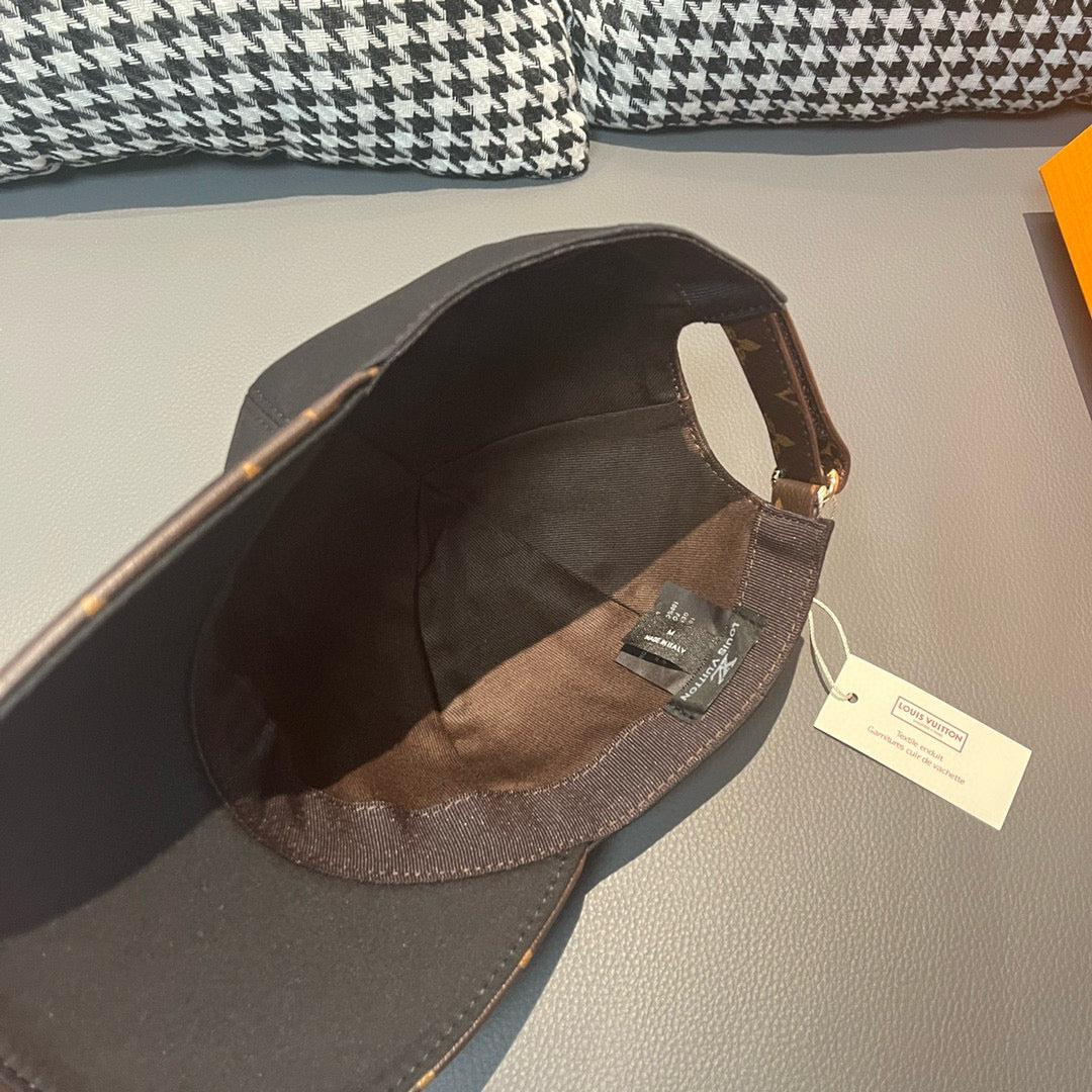 Louis Vuitton cap interior view with brim lining and adjustable strap with tag.