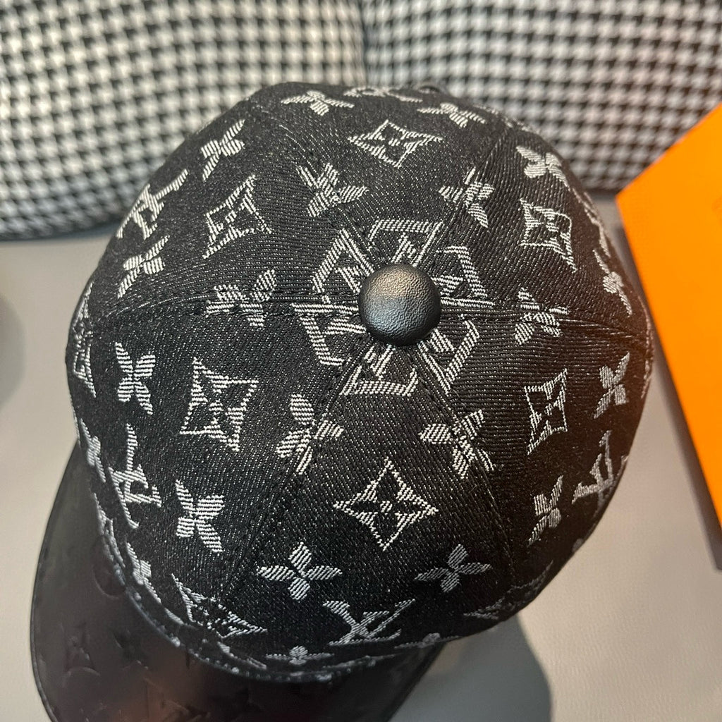 Louis Vuitton monogram cap top with circular button and repeating LV symbols