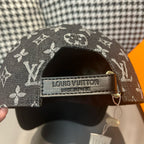 Louis Vuitton monogram cap inner label with Louis Vuitton branding and tan tab