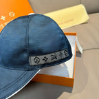 Louis Vuitton cap with dark blue mesh texture and patterned LV logo band