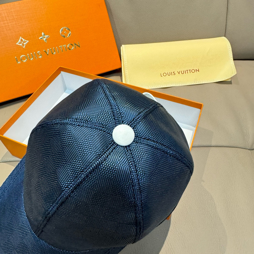 Blue Louis Vuitton baseball cap top view with round button and stitched panels.