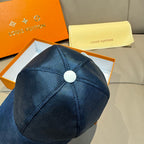 Blue Louis Vuitton baseball cap top view with round button and stitched panels.