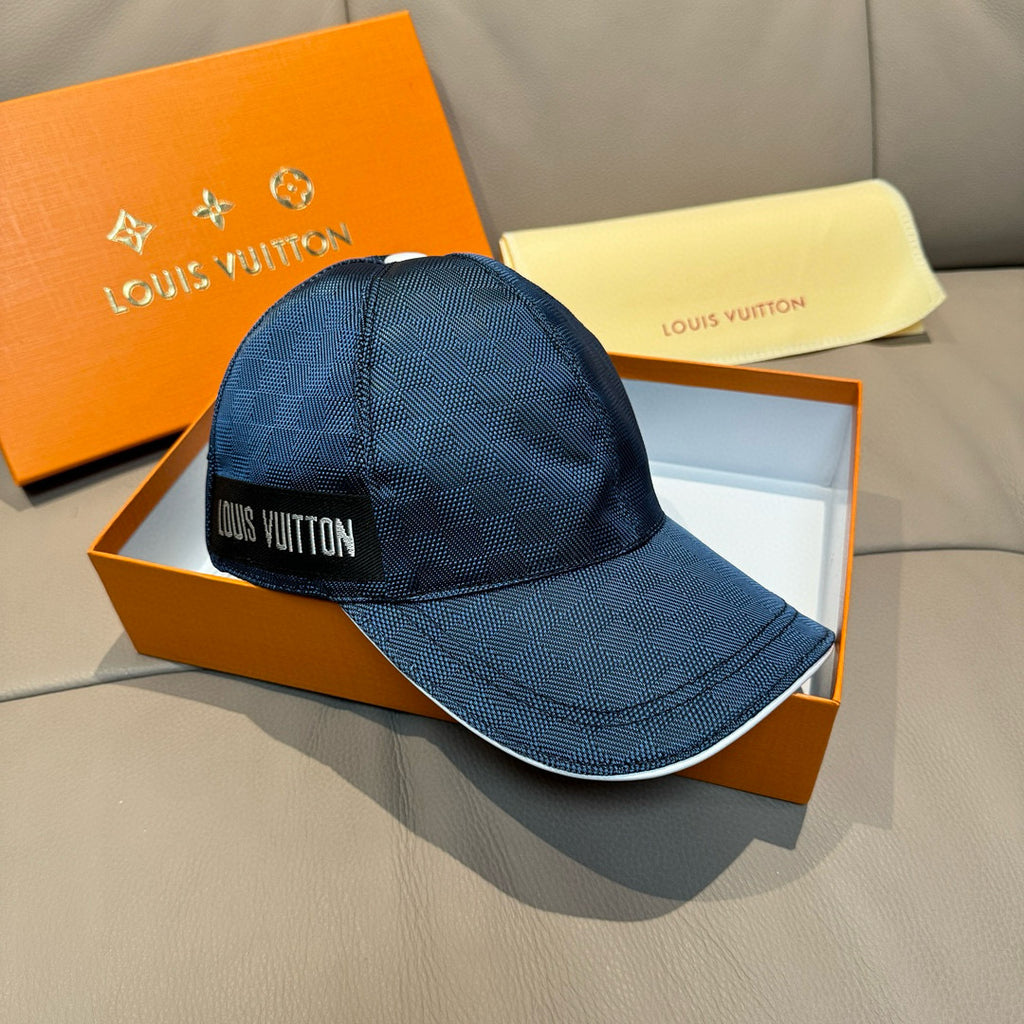 Blue Louis Vuitton baseball cap with front logo patch and curved brim.