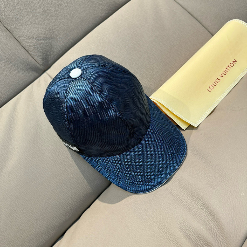 Blue Louis Vuitton baseball cap viewed from the side, with small top button.