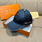 Blue Louis Vuitton baseball cap with front logo patch and curved brim.
