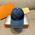 Blue Louis Vuitton baseball cap with front panel logo detail and curved brim.