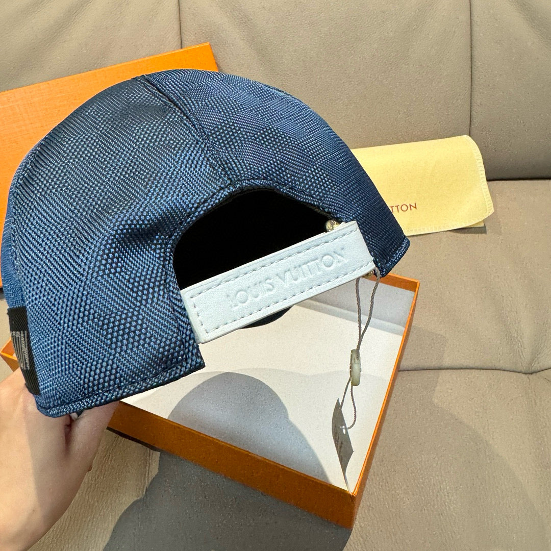 Blue Louis Vuitton baseball cap with interior headband and side label.