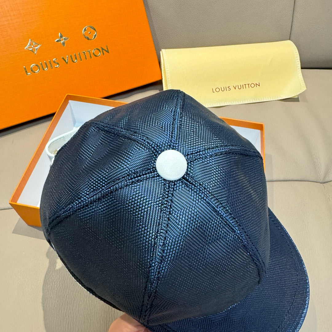Navy Louis Vuitton baseball cap with white top button and textured crown