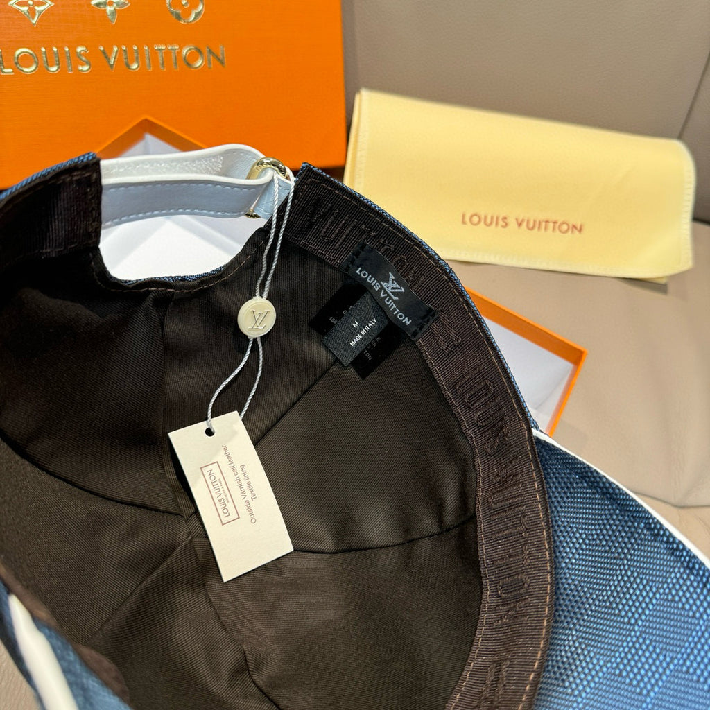 Black interior panel and navy Louis Vuitton cap with hang tag visible inside