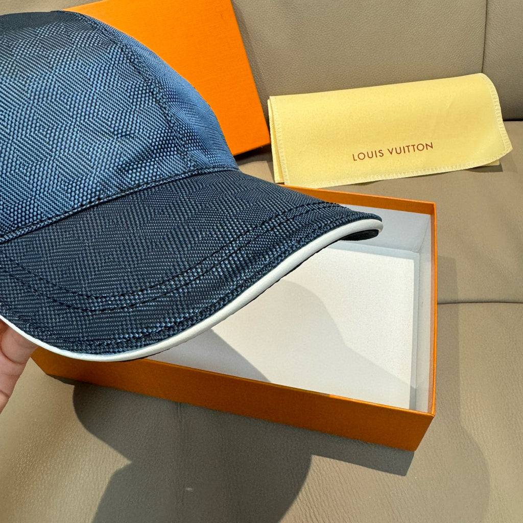 Blue Louis Vuitton baseball cap close-up of curved brim and woven texture