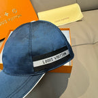 Navy Louis Vuitton cap with front logo strap detail and textured fabric