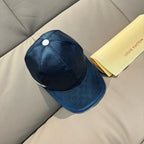 Dark blue Louis Vuitton baseball cap with round button and curved brim