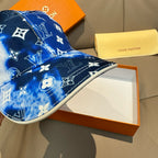 Louis Vuitton blue cap with white monogram pattern, curved brim and side stitching.