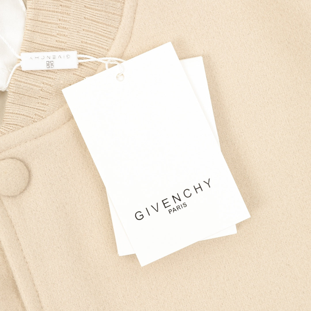Beige bomber jacket with hanging tag labeled GIVENCHY PARIS