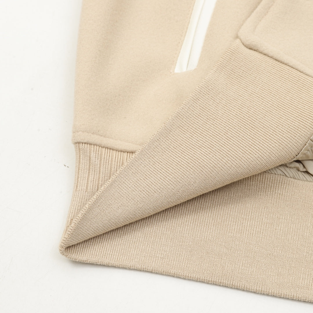 Beige bomber jacket knit hem and ribbed side trim with white stripe