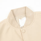 Beige Givenchy bomber jacket collar with snap placket and ribbed trim